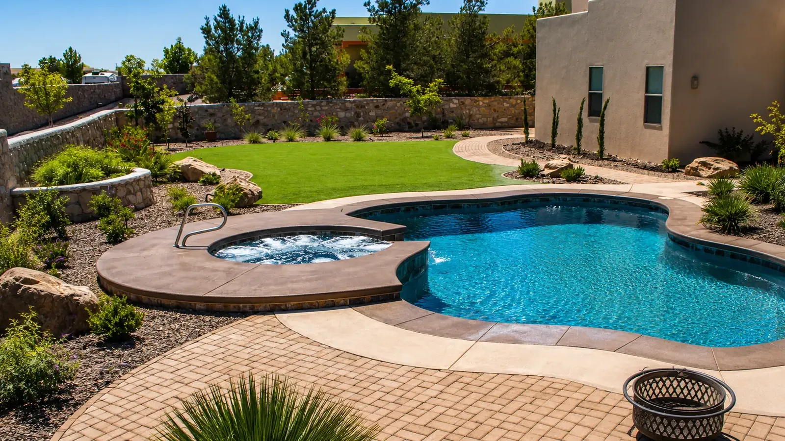 Backyard transformation in East Las Cruces, NM with a fiberglass pool, paver deck, lawn, and desert landscaping Backyard transformation in East Las Cruces, NM with a fiberglass pool, paver deck, lawn, and desert landscaping