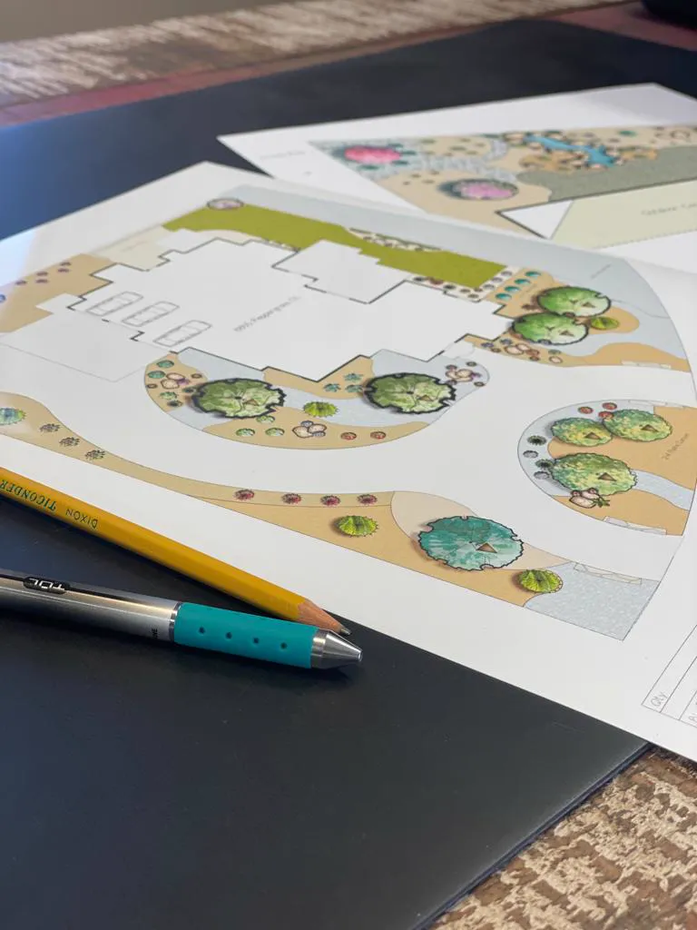 Printed landscape design plan for a Las Cruces, NM home showing the house footprint and garden beds Printed landscape design plan for a Las Cruces, NM home showing the house footprint and garden beds
